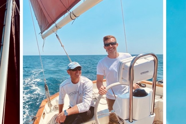 a man standing in front of a boat