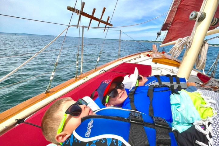a person sitting on a boat in a body of water