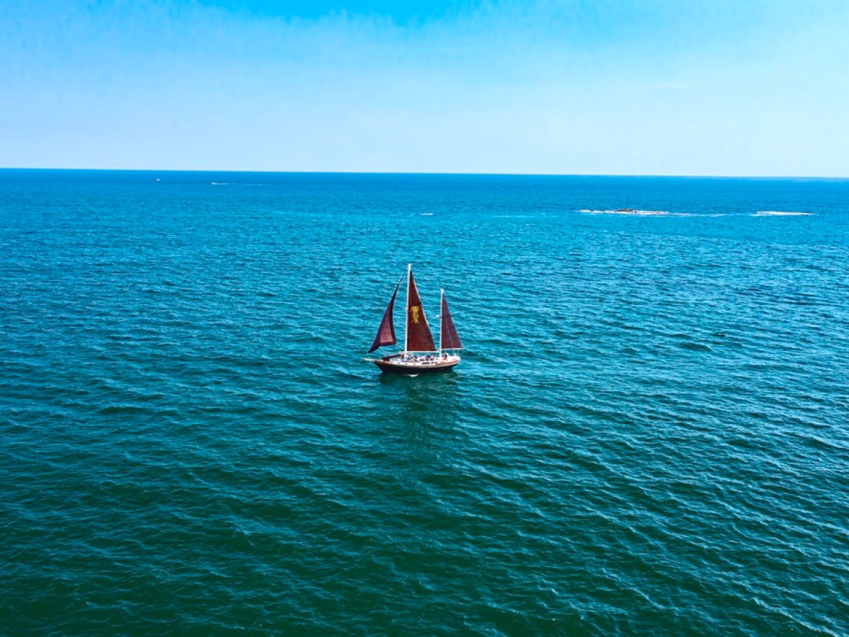 a small boat in a large body of water